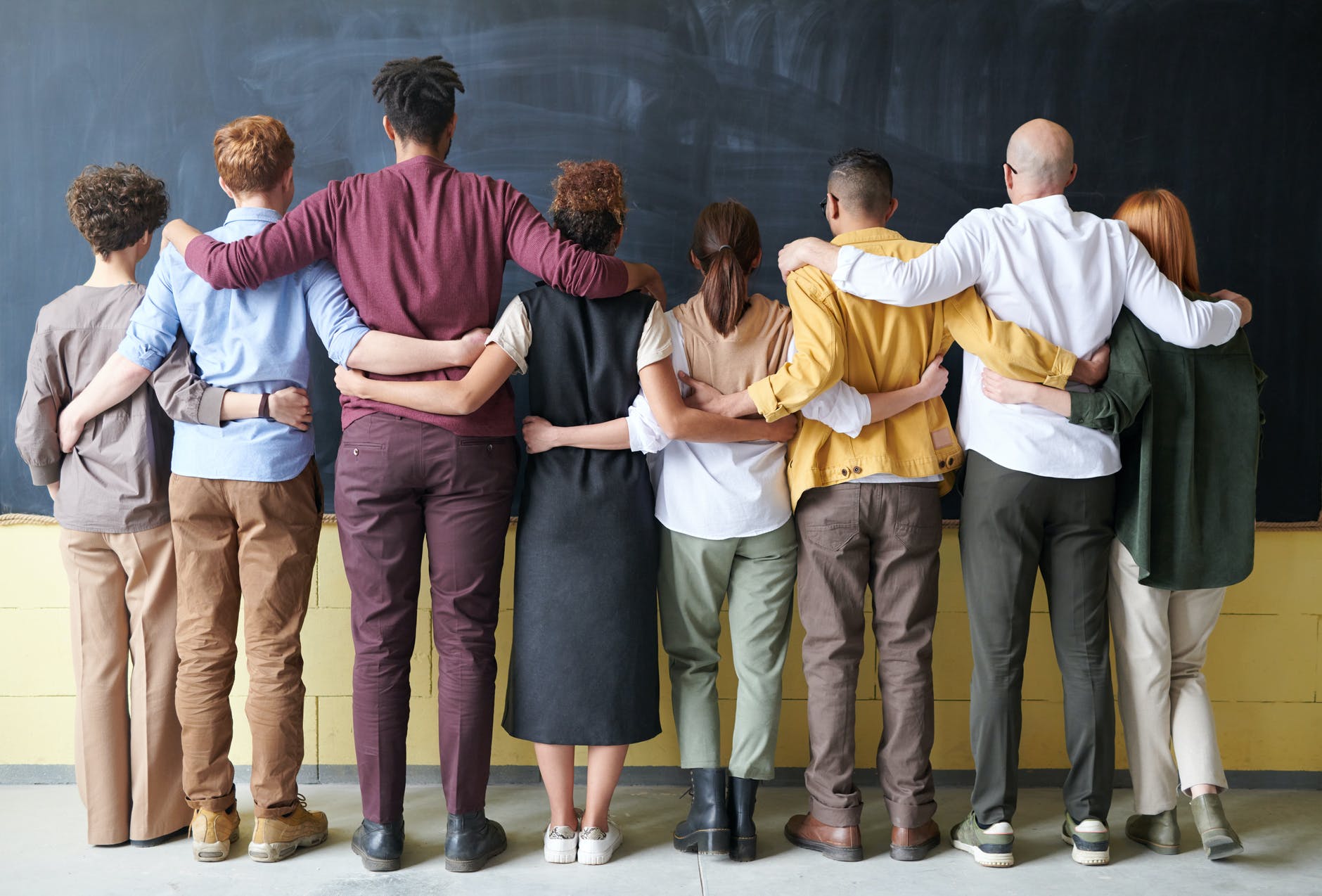 group of people standing indoors